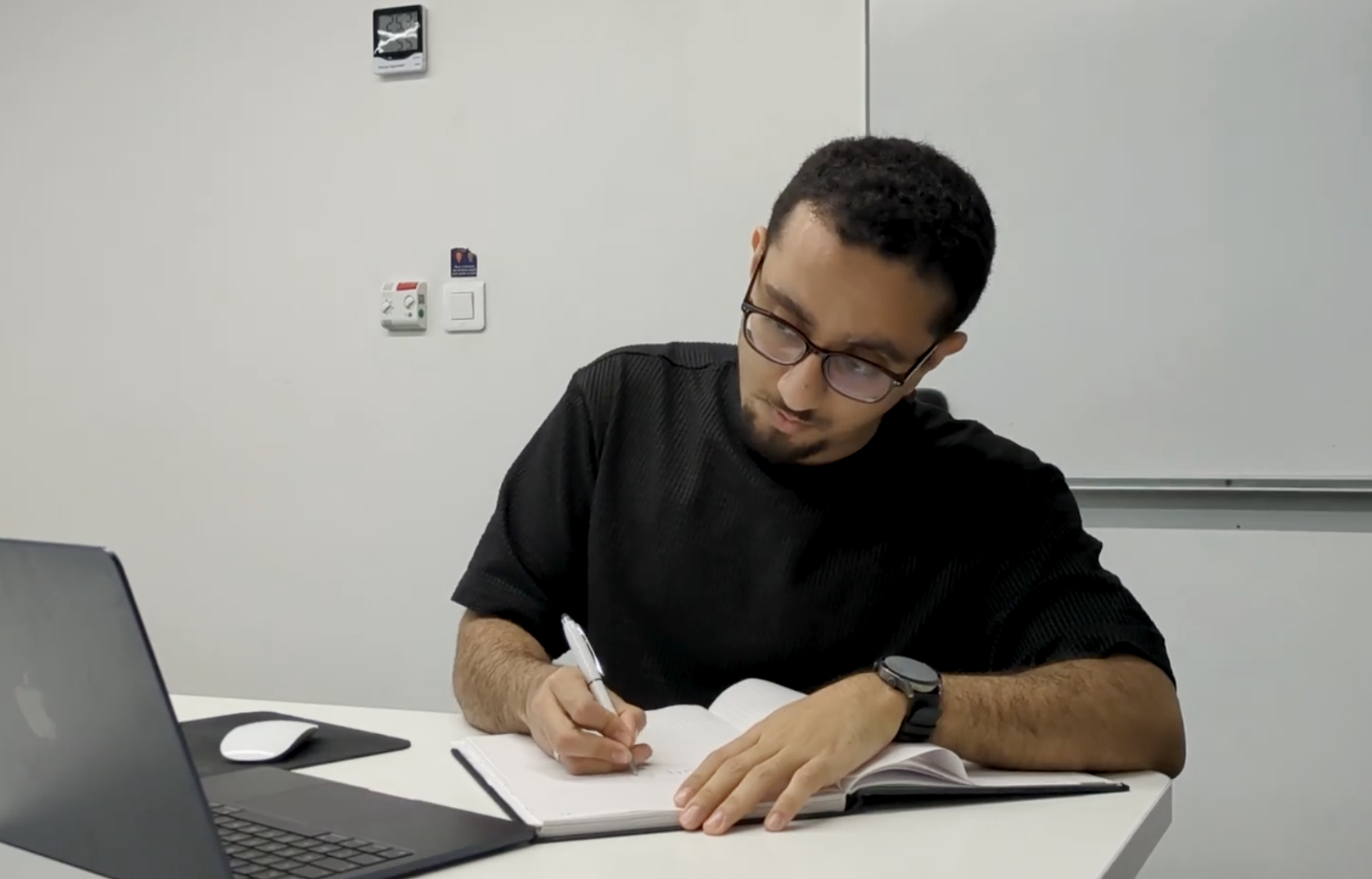 Ali Alhebshi working at his desk — Alivate consultancy